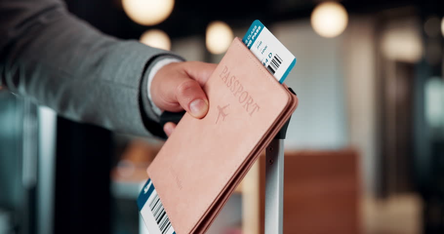 Hands, ticket and passport at airport for travel, international journey and business trip with luggage. Boarding pass, documents and person with suitcase for immigration, passenger or global flight