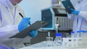 Environmental scientist testing water quality sample for microplastics and chemical contaminants in laboratory.	 - Powered by Shutterstock - Get 15% off with code: PIKWIZARD15