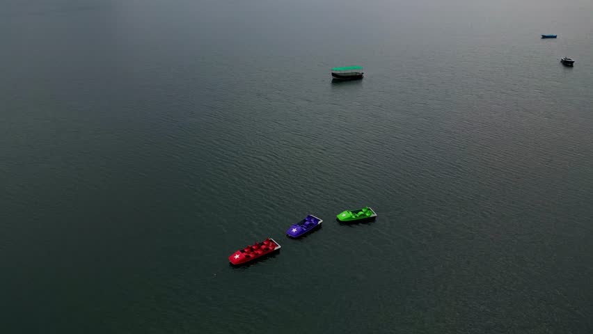 Scenic Lake Boats Captured with Drone Retreat Shot