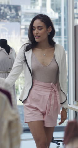 Choice, retail and woman in boutique, fashion and options with discount deal, expensive and promotion. Consumer, person or customer with decision, clothes or buying with product sale or shopping mall