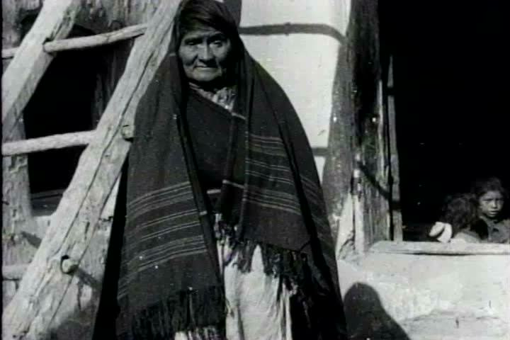 1910s, 1920s - Scenes of native people - An elder wrapped in a blanket, adobe homes and native children playing.