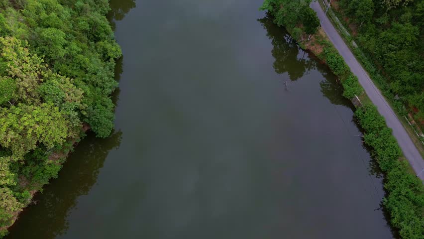 Aerial View of a Winding Road Beside a Lake