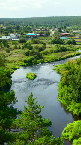 Majestic View From Above Capturing Tranquil Waterway Weaving Through Vibrant Meadows And Forests. Media
