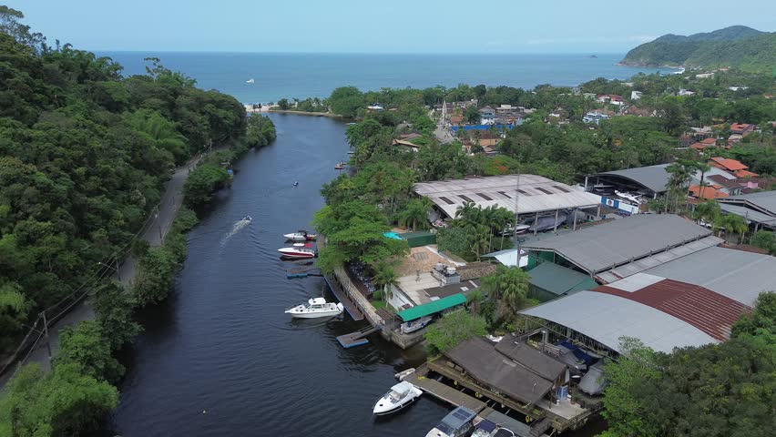 Beach and river and boat going