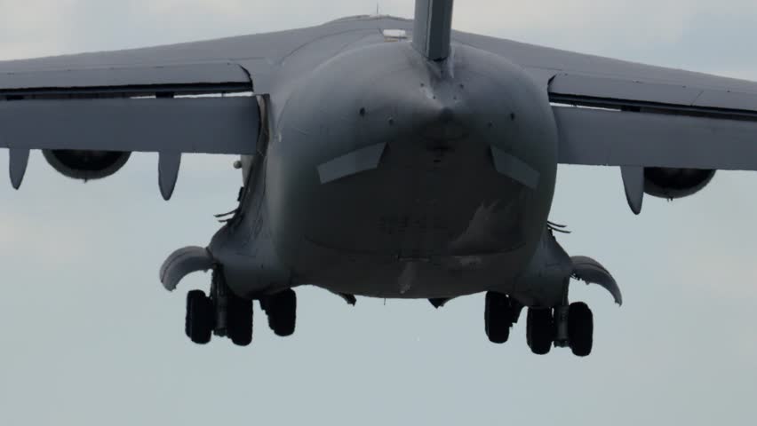 C-17 Globemaster conducts multiple flight maneuvers demonstrating capabilities in military logistics and troop transport. Aircraft shows aerial mobility during operations.