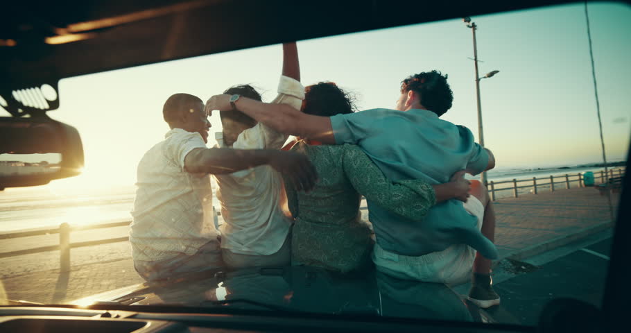 Back, hug and road trip with friends on car bonnet together for adventure, journey or travel. Beach, promenade and sunset with group of people embracing outdoor for bonding, holiday or vacation