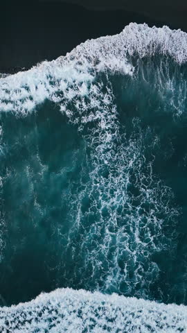 Aerial view of black beach with foam waves Atlantic beach. Sea ocean waves reaching shore