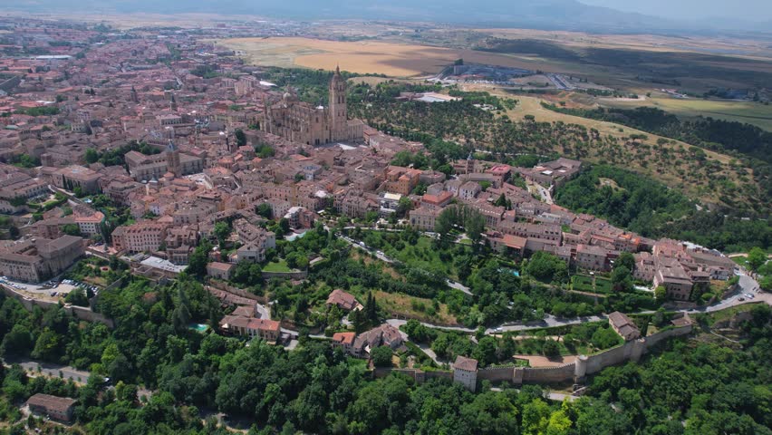 Aerial view around the old town of the city Segovia in Spain on a sunny summer noon.
