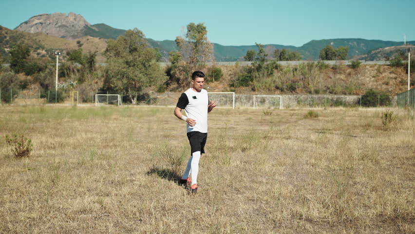 Player Preparing For The Soccer Game In A Abandoned Pitch