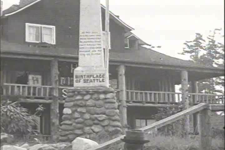 1910s - Seattle, Washington 1917 - A historic marker commemorating the birthplace of Seattle in November 1851 and the lighthouse at Alki