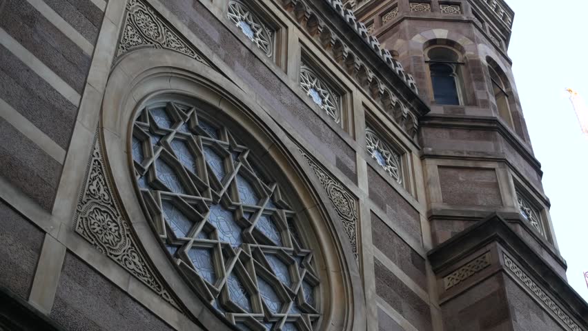 New York Central Synagogue old historic building 1872, Lexington avenue, United States of America. Jewish congregation in Manhattan. Judaism religion landmark. Star of David geometry ornament. Window