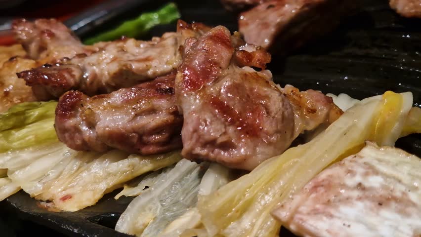 Grilled Meat on Cabbage, Korean Barbeque at Restaurant, Close Up