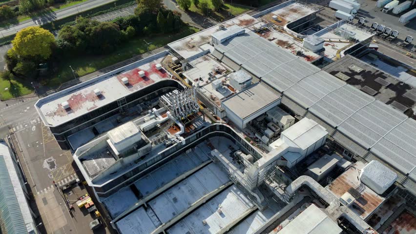 High angle aerial drone view of a large pharmaceutical research and development building with modern scientific laboratories in central Nottingham UK