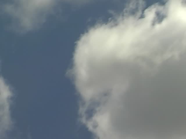 white clouds in the blue sky on summer day