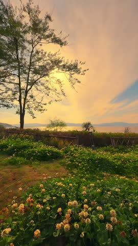  a Golden Sunset Over a Scenic Lake in Yunnan, China, with Moving Clouds