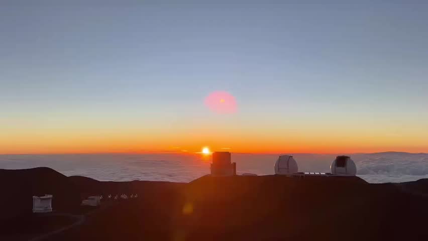 Breathtaking high-altitude sunrise above a dense sea of clouds