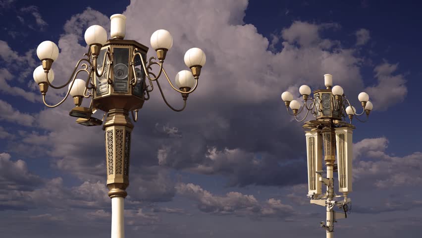 Street lamp on Tiananmen Square in Beijing, China (against the background of a beautiful sky with clouds), with propaganda or public announcement speakers. 4K, time lapse  