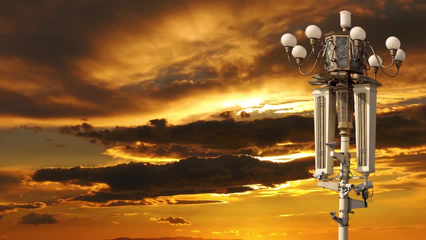Street lamp on Tiananmen Square in Beijing, China (against the sunset), with propaganda or public announcement speakers. 4K, time lapse  