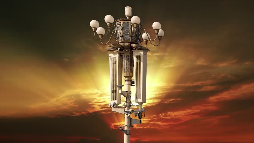 Street lamp on Tiananmen Square in Beijing, China (against the sunset), with propaganda or public announcement speakers. 4K, time lapse  