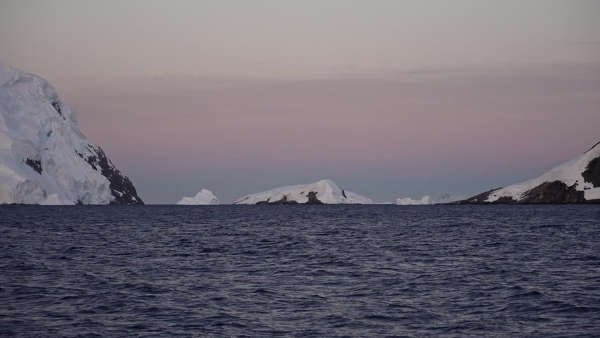 Icy Antarctic Passage with Snow Covered Shores