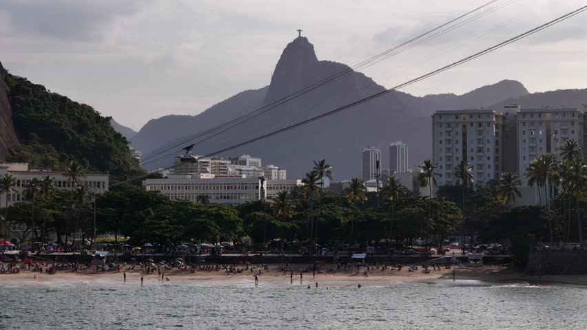 Aerial view of Praia Vermelha beach with the Sugarloaf cable car and Corcovado mountain in the background, Rio de Janeiro, State of Rio de Janeiro, Brazil.