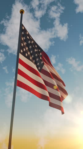 American flag flies in the sky at dawn on Veterans Day