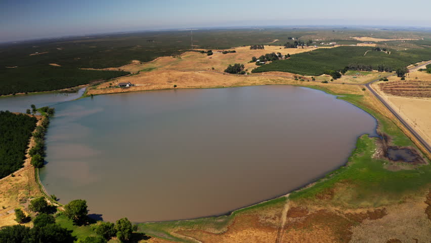 Drone view of a River running through farmland in Modesto, California