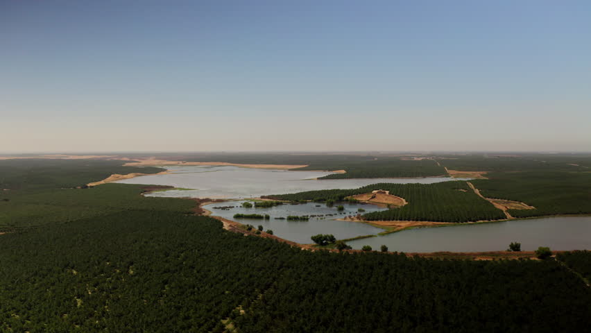 Drone view of a River running through farmland in Modesto, California