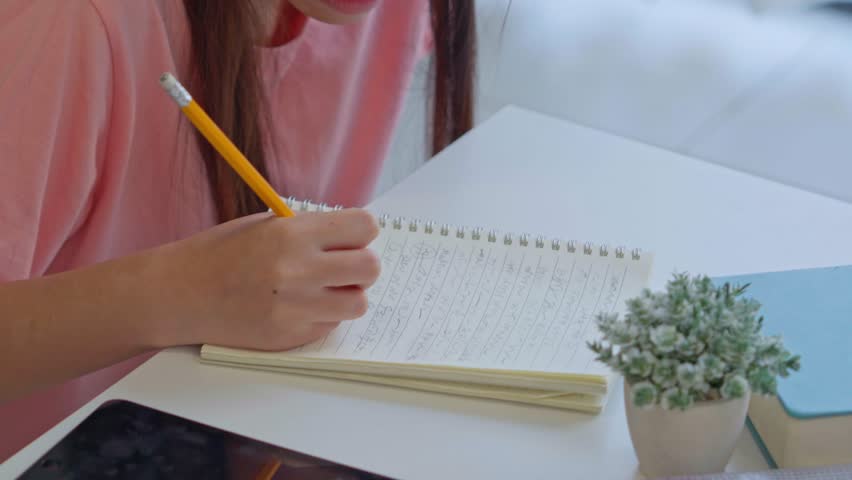 Two Asian girl using tablet search information for report