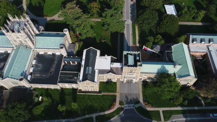 Aerial view of Vassar College featuring collegiate gothic architecture, green roofs and lush campus greenery in Poughkeepsie, New York, United States.