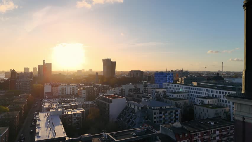 Aerial view of the Hamburg city skyline featuring modern architecture and rooftops at sunset near St. Michaeliskirche, Hamburg, Hamburg, Germany.