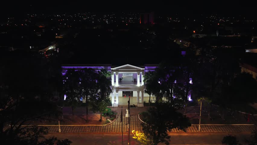 City hall of Villarica, Paraguay illuminated at night, symbolizing local authority and public services in a community