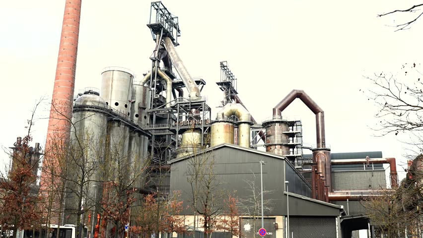 Industrial steelworks complex in Belval Luxembourg with pipes and chimneys