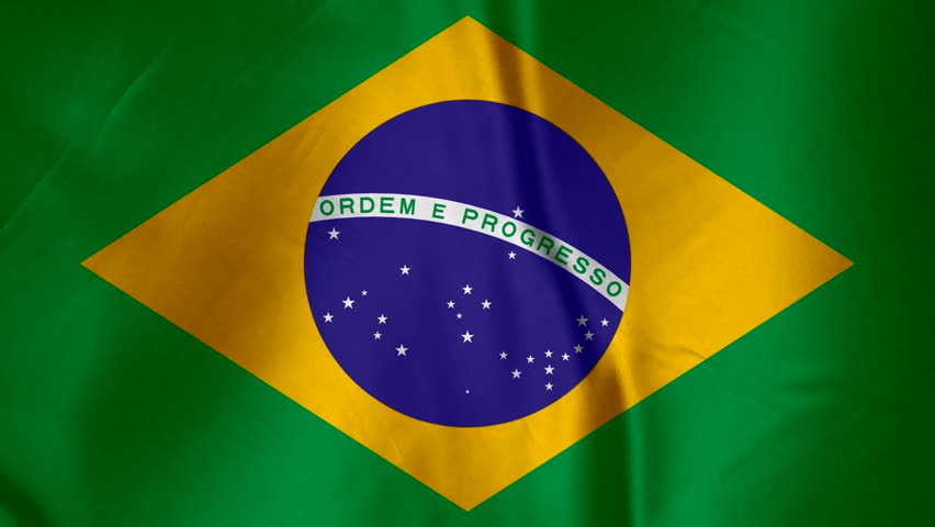 Close up of the Brazilian flag waving with detailed texture and fabric folds showing the national colors green yellow blue and white stars