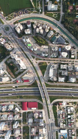 Top down aerial view of curved streets and residential neighborhood blocks.