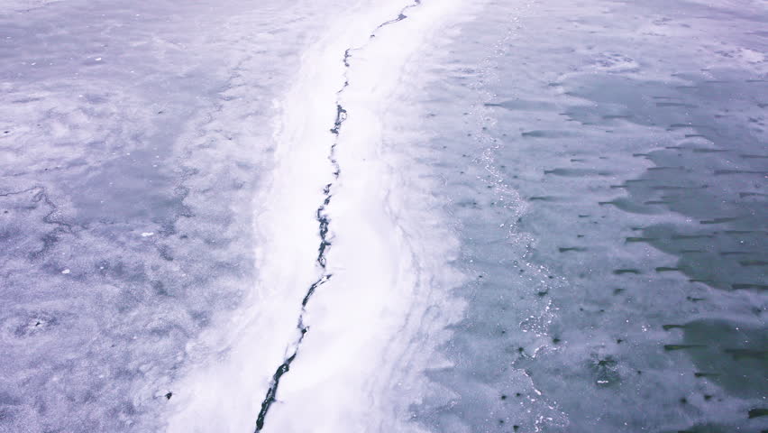 Aerial view of cracked ice and frozen water on the Great Lakes during winter