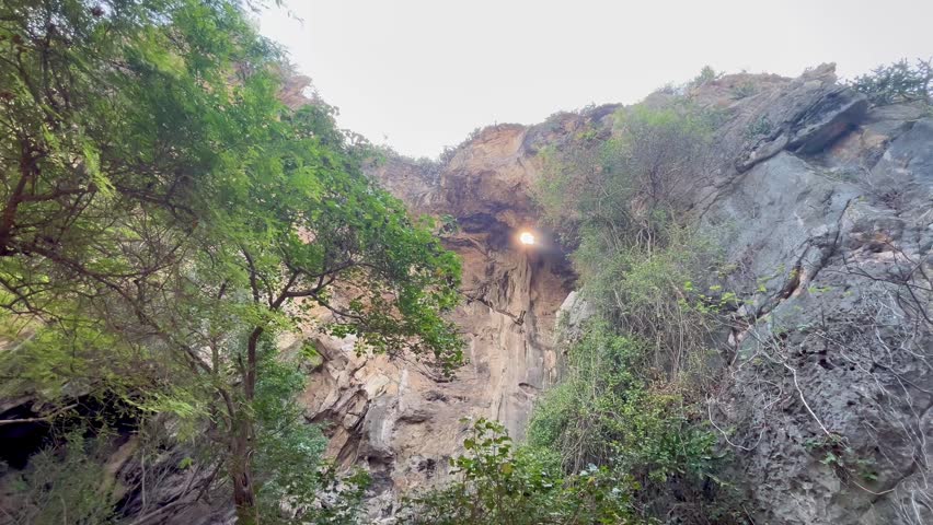 Looking up through inside a cave