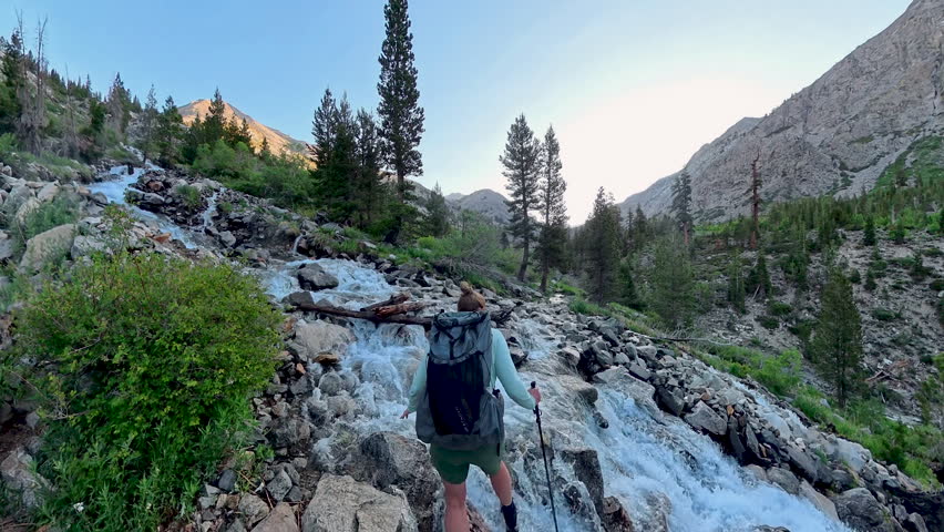 Woman Crosses Rushing Creek on the Pacific Crest Trail