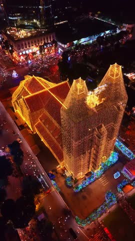 Drone view of Notre Dame Cathedral illuminated for christmas in Saigon Vietnam