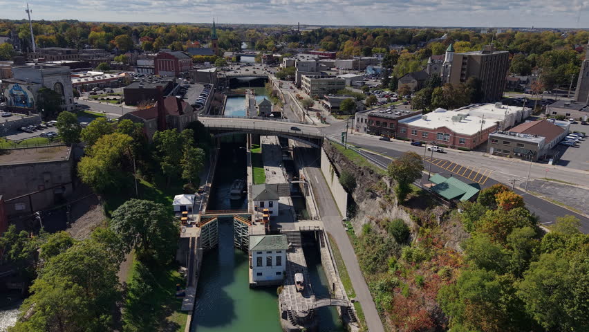 Aerial view of Erie Canal locks in Lockport, New York, USA with historic staircase lock system and downtown cityscape