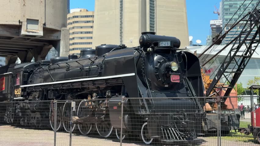 CN 6213 Steam engine in toronto at roundhouse park with cn tower behind
