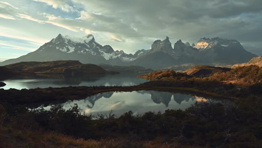 Time lapse at sunset over the lakes and mountains Cerro Paine Grande and Los Cuernos in Torres del Paine national park, Patagonia, Chile 