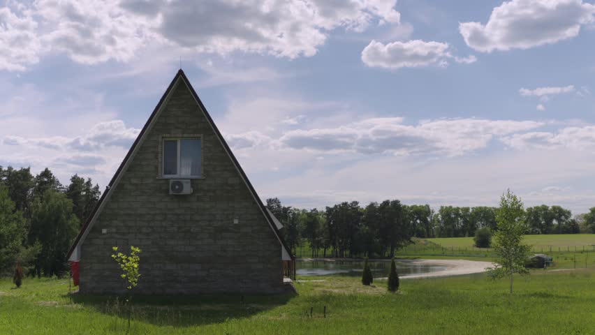 Scenic A-Frame House Near a Forest Lake. Time lapse