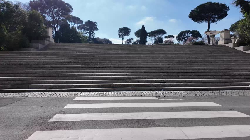 Cinematic Shot Of A Majestic Stone Staircase Entrance To A Park