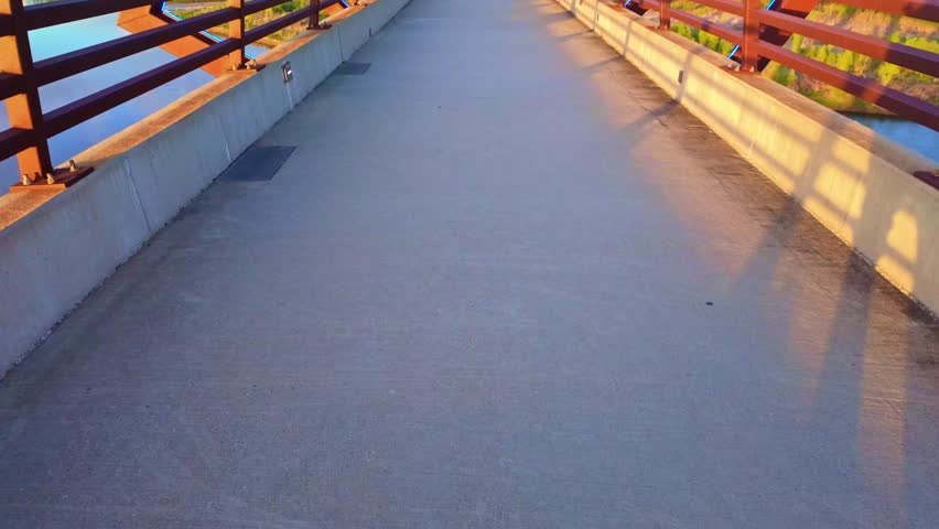 Scenic sunset view of High Trestle Trail Bridge in Iowa during evening recreation hours.