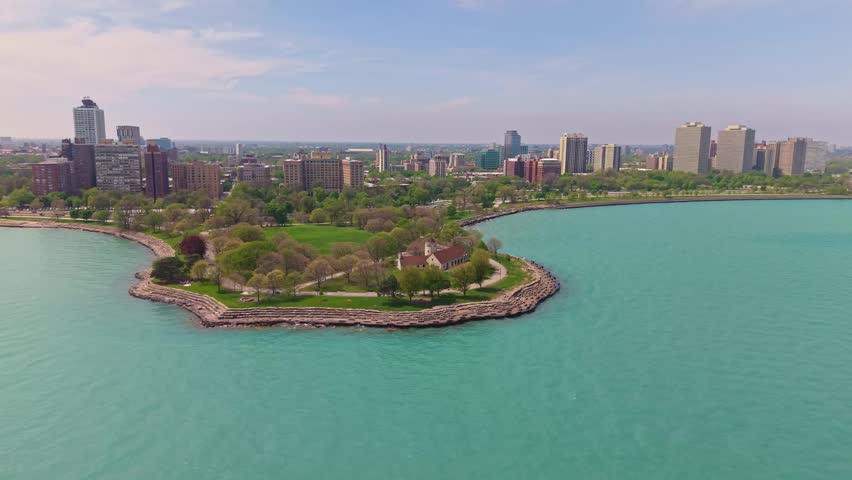 Scenic high angle panoramic view of the Chicago skyline with Lake Michigan stretching along the urban waterfront