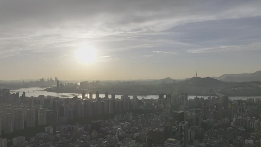 Aerial view of Sinnonhyeon Station and Han River landscape at sunset in Seoul