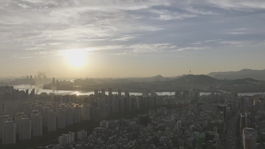 Aerial view of Sinnonhyeon Station and Han River landscape at sunset in Seoul