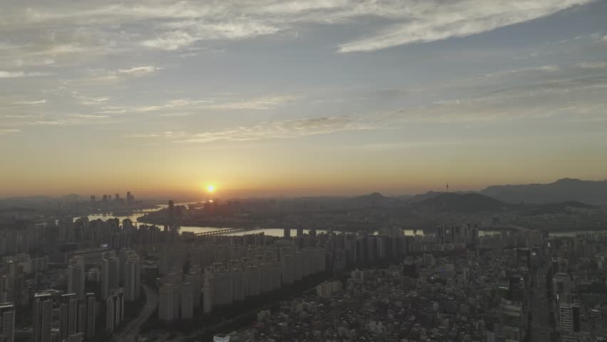 Aerial view of Sinnonhyeon Station and Han River landscape at sunset in Seoul