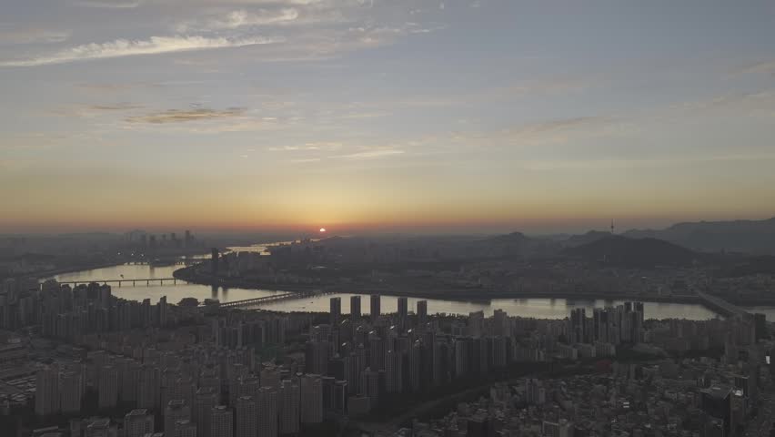 Aerial view of Sinnonhyeon Station and Han River landscape at sunset in Seoul